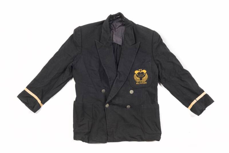 NEW ZEALAND ALL GOLDS BLAZER, black with "NZ/ (pair of kiwis)/ (football)/ (crossed silver-ferns)/ "ALL-GOLDS" embroidered badge on pocket. Fair condition (some holes).