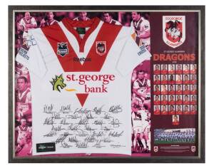 ST.GEORGE ILLAWARRA DRAGONS, signed jumper from 2010 (Premiership Year) with 31 signatures, window mounted with pictures of players, framed & glazed, overall 107x86cm.