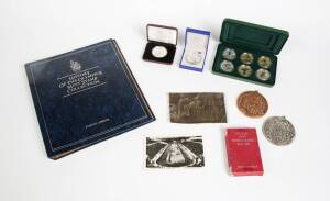 OLYMPICS COLLECTION, noted 1896 replica medals (2) & postcard; 1924 official postcard of Paavo Nurmi; range of Olympic coins (21) including 1952 Finland 500 Markkaa; 1956 car badge & serviette; stamp collection; 1984 & 1992 medallions; Sydney 2000 Autogra