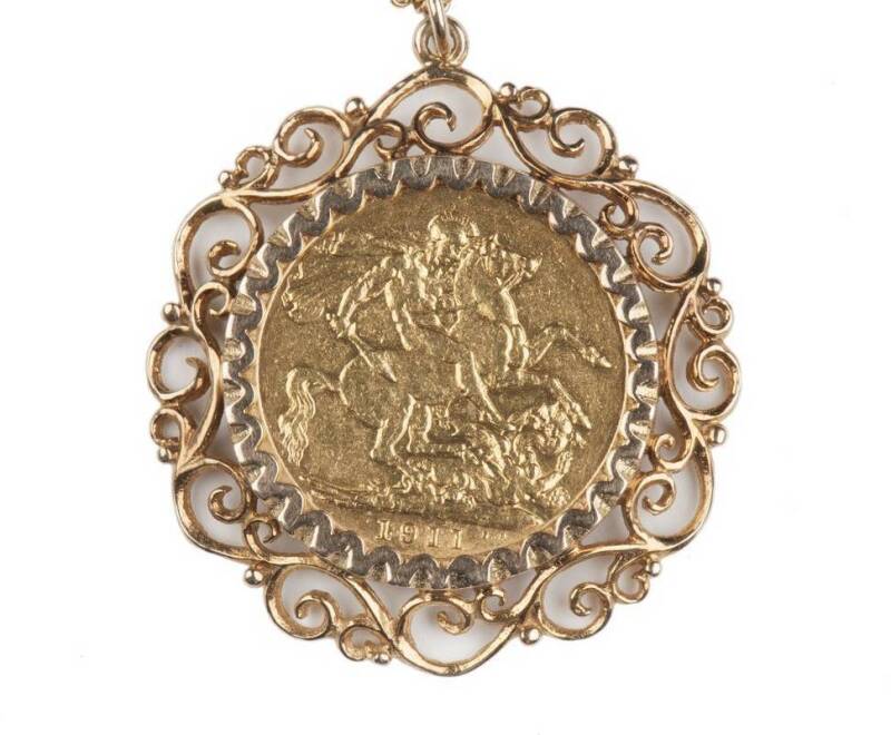 1911 KGV sovereign, as a necklace in an elaborate 9ct mount..