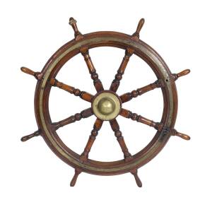 A ship's wheel from the Defender, brass bound oak and rope, 19th century