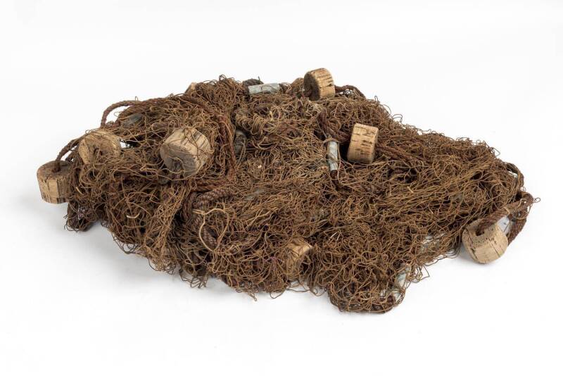 Antique fishing net with lead weights and cork floats