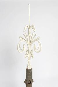 An antique wrought iron architectural finial