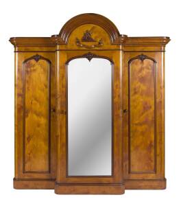 A solid huon pine 3 door wardrobe with armorial crest