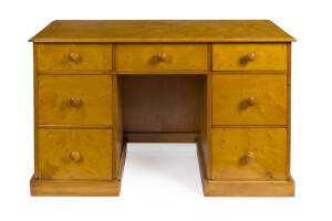 A solid birdseye huon pine twin pedestal desk, 19th C.