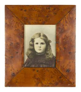 A handcoloured photo portrait of a girl in a highly figured huon pine frame25.5 x 22 cm (frame size) 