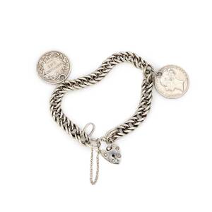 An antique bracelet, of double curblink design, hung with heart shaped padlock and two shilling charms. Silver.