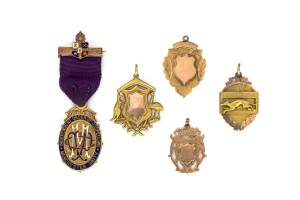 Five antique gold fobs, including Australian Coat of Arms, Independant Order of Oddfellows, and a coursing medallion. 9ct and 15ct gold.