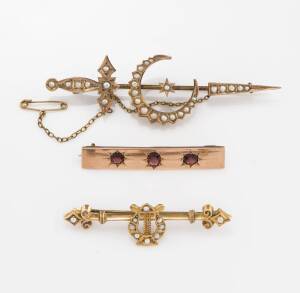 Three antique Australian brooches, a 15ct garnet bar brooch, a seed pearl dagger and crescent brooch by Willis, and a seed pearl harp brooch by Willis. Total weight 16.94 grams. 