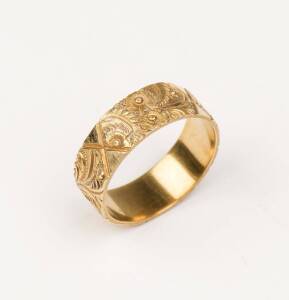 An antique gold band ring, Kerr, hand carved floral, foliate and geometric decoration. 18ct yellow gold. Weight 4.43 grams. Size O.