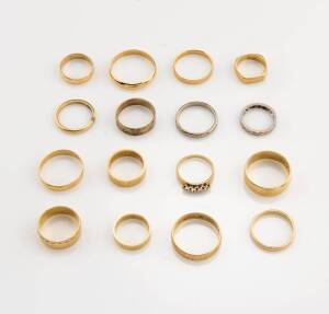 Sixteen gold rings, fourteen gold bands, an all-around diamond eternity ring and one other. 18ct yellow and white gold. Total weight 74.6 grams. 