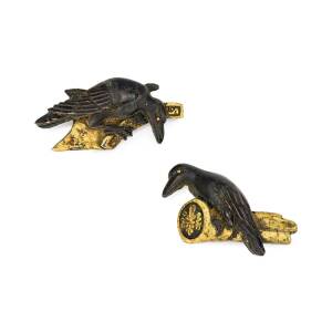 A pair of Japanese menuki, designed as two perching ravens. Length 27mm.