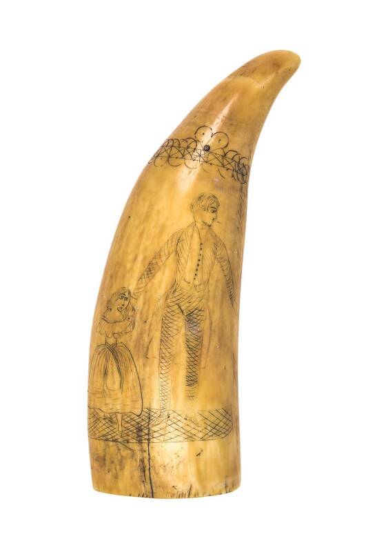 A scrimshaw whale's tooth engraved with man and child