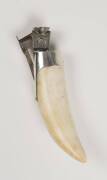 A cigar cutter, whale tooth and sterling silver, circa 1900