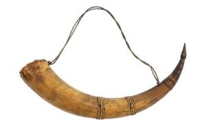 A powder horn with carved bands of decoration, 19th century