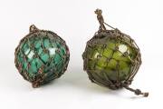 Two glass and rope buoys, early 20th century