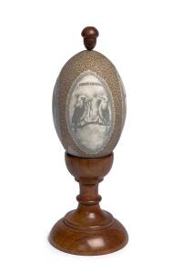 A carved emu egg on blackwood stand, circa 1900