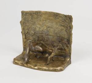 An Australiana bookend, brass and silver gilt, 19th century, 12.5cm high. 