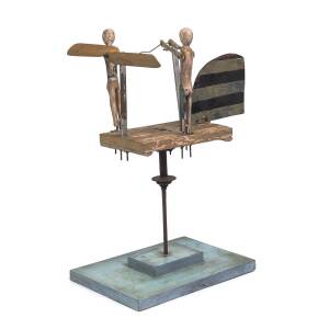 A folk art whirligig of two figures, painted wood and metal, Queensland origin, early 20th century