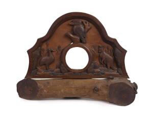 A folk art carved timber clock case, circa 1910