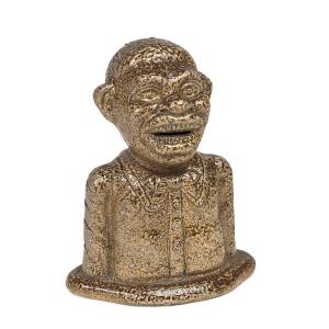 An Australian pottery workmans piece "Jolly Nigger" salt glazed money box, late 19th/early 20th century