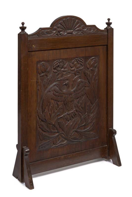 An Australian arts and crafts fire screen with carved wedged eagle and Waratahs, carved blackwood, circa 1900 