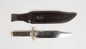 A Bowie knife in leather scabbard, Australian, 20th century