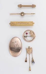 A collection of Australian yellow gold jewellery comprising5 brooches and a pendant