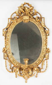 A gilt gesso oval girandole mirror, English in the French Style, 19th century