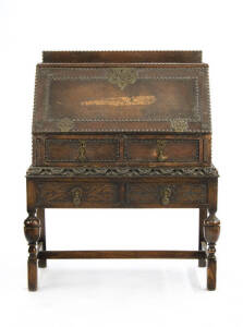 An unusually studded leather and brass-mounted bureau, English circa 1900