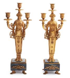 A pair of French Empire style gilt bronze and marble three light candelabra