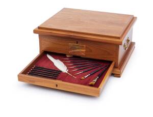 A Windsor and Newton watercolour millennium chest, an Australian Tourism Awards box, a magnifying glass, a glass paper weight & a letter rack