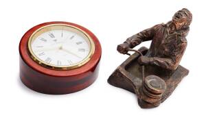 A cast copper sculpture of sail trimmer, by Anna Holan, signed Holan CAIRNS and&nbsp;a Michele Perrenoud desk clock
