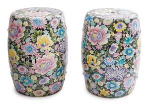 A pair of Chinese famille noir floral drum shaped porcelain stools, 20th century