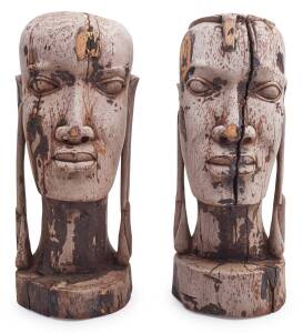 A pair of African carved wooden heads