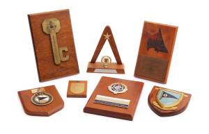 A collection of various trophy plaques