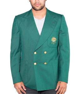 BEN LEXCEN'S 1977 AMERICA'S CUP BLAZER, double-breasted green blazer, with wire embroidered Australian Coat-of-Arms & "America's Cup, 1977" on pocket, modified by Ben with set of Ferrari gold buttons,