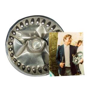 PLYMOUTH HUB-CAP - "AMERICA'S PLATE": Shortly after the presentation of the America's Cup, the New York Yacht Club's Commodore, Robert Stone Jr, gave Ben Lexcen a special gift - an old Plymouth hub-cap that had been flattened. This was in response to Ben 
