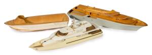 CRUISER: Collection of Ben Lexcen carved fruitwood model boats and hull designs, one a futuristic design deep water motor yacht, one of Ben's last projects.