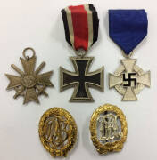 MEDALS GERMANY: Iron Cross 3rd class, Cross of Merit with swords (no ribbon) and Faithful Service Decoration (25 years), also two dress badges.