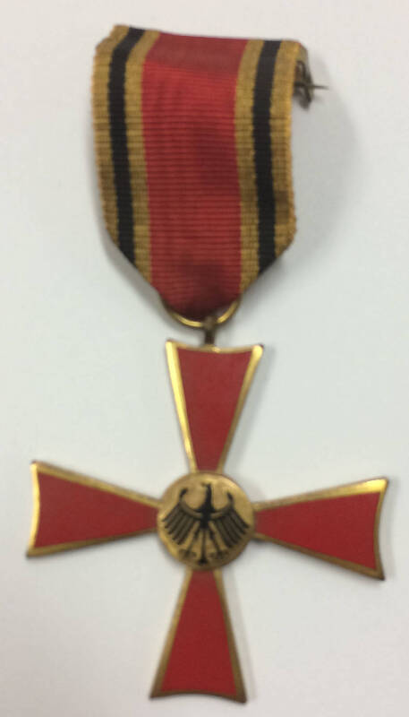 MEDALS: GERMANY, 1957-66 Order of Merit (54mm), red enamel gilt-edged cross pattée, circular central gilt black eagle, wings outstretched, rev. hinged pin for wear in original fitted embossed case of issue with maker’s mark 'C.E.JUNCKER / BERLIN SO 36' in