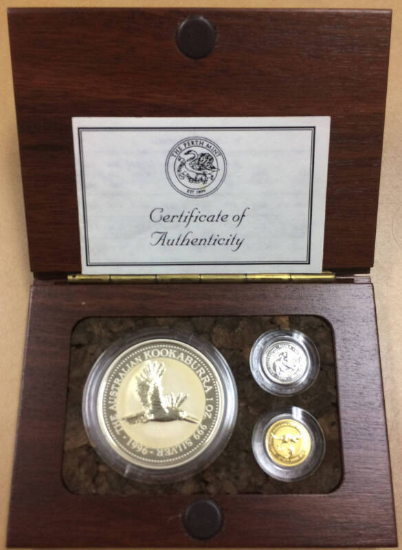 $5 Gold Nugget (1.571g), $5 Platinum Koala (1.571g), and $1 1oz Silver Kookaburra (31.1g) in Perth Mint wood presentation box.