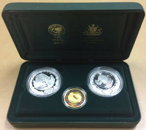 ONE HUNDRED DOLLARS: 'The Sydney 2000 Olympic Silver Coin Collection' (#1602) cased set comprising gold $100 'Achievement - Stadium' 10.021g 99.99% plus silver $5 'Harbour of Life - Water' and 'Platypus / Water Lily' each 31.6g 99.9%. 