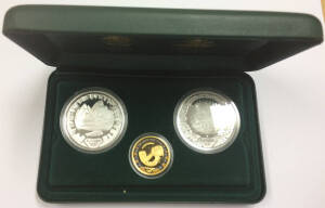 ONE HUNDRED DOLLARS: 'The Sydney 2000 Olympic Silver Coin Collection' (#1490) cased set comprising gold $100 'Achievement - Athlete' 10.021g 99.99% plus silver $5 'Harbour of Life - Land' and 'Echidna and Tea Tree' each 31.6g 99.9%. 