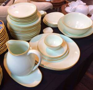 A Casa Domani green dinner set comprising of 38 pieces including dinner plates, side plates, serving bowls and a water jug