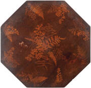 AUSTRALIANA: Fine Antique splatter work Gypsy/wine table c1880. Octagonal top decorated with stencil work fern & wattle motif. Tripod base with ebonized turned legs & gilt highlights. Original patina, slight water damage spot on top. H. 66cm. VG condition - 2