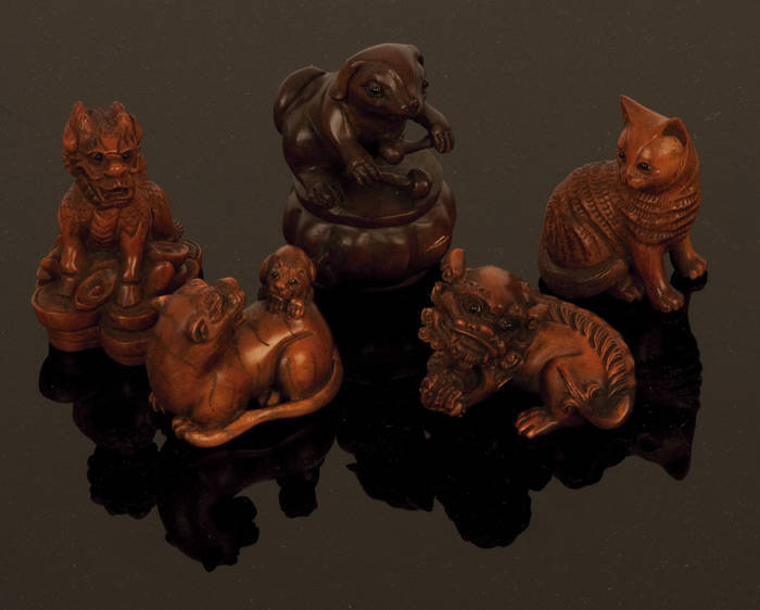 NETSUKE: Collection of Japanese boxwood carvings; Foo dogs (6); rats & cats (14); dogs (5); Mermaids & nudes (5). 20th century, excellent condition