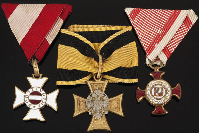 AUSTRO-HUNGARIAN: Golden Cross of merit (red & white ribbon); Military Service Cross 1st class (black & yellow ribbon); Military Order Maria Theresia (red & white ribbons). G/VG condition.