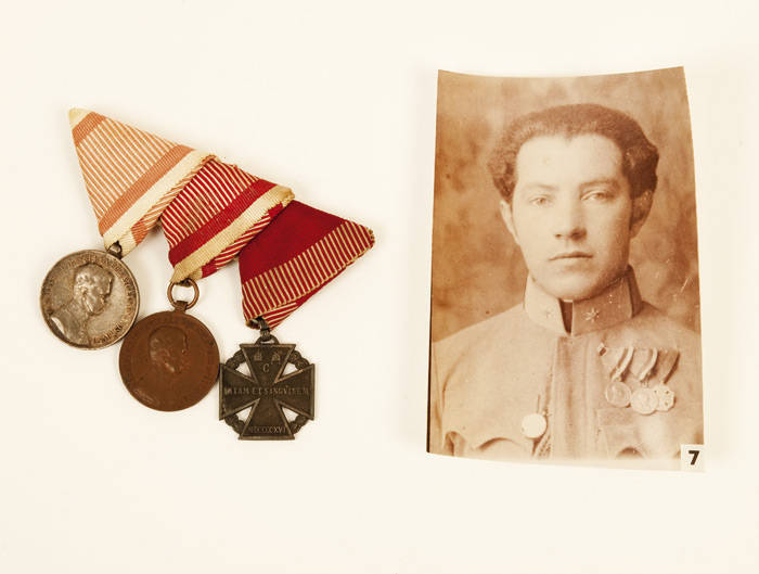 Group of (3) Austro-Hungarian medals with accompanying photo portrait of a soldier wearing them: Silver Bravery Medal 2nd class, Bronze Bravery Medal (awarded in 1917-18) & Karl Troop Cross; Other medals: Silver Medal of Military Merit with swords on silv