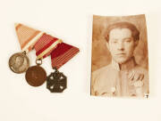 Group of (3) Austro-Hungarian medals with accompanying photo portrait of a soldier wearing them: Silver Bravery Medal 2nd class, Bronze Bravery Medal (awarded in 1917-18) & Karl Troop Cross; Other medals: Silver Medal of Military Merit with swords on silv